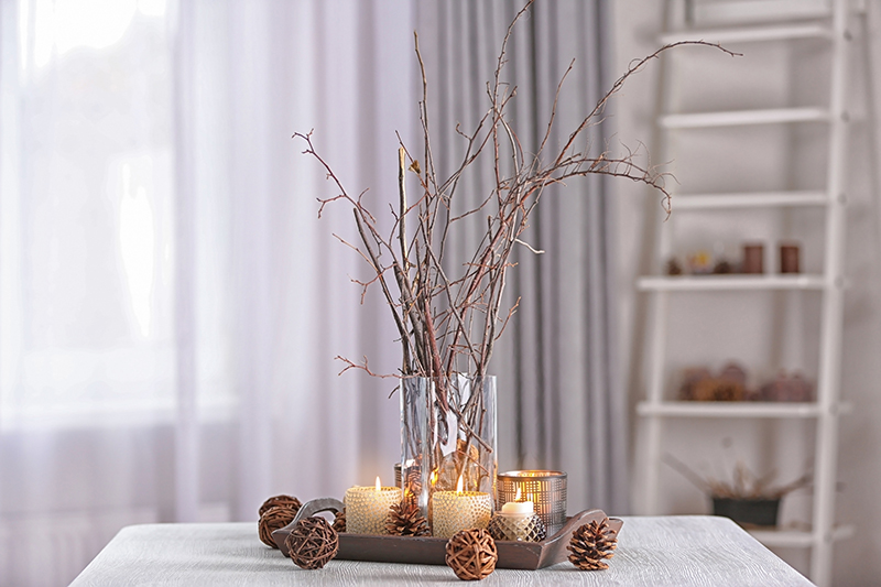 a base of branch with candles