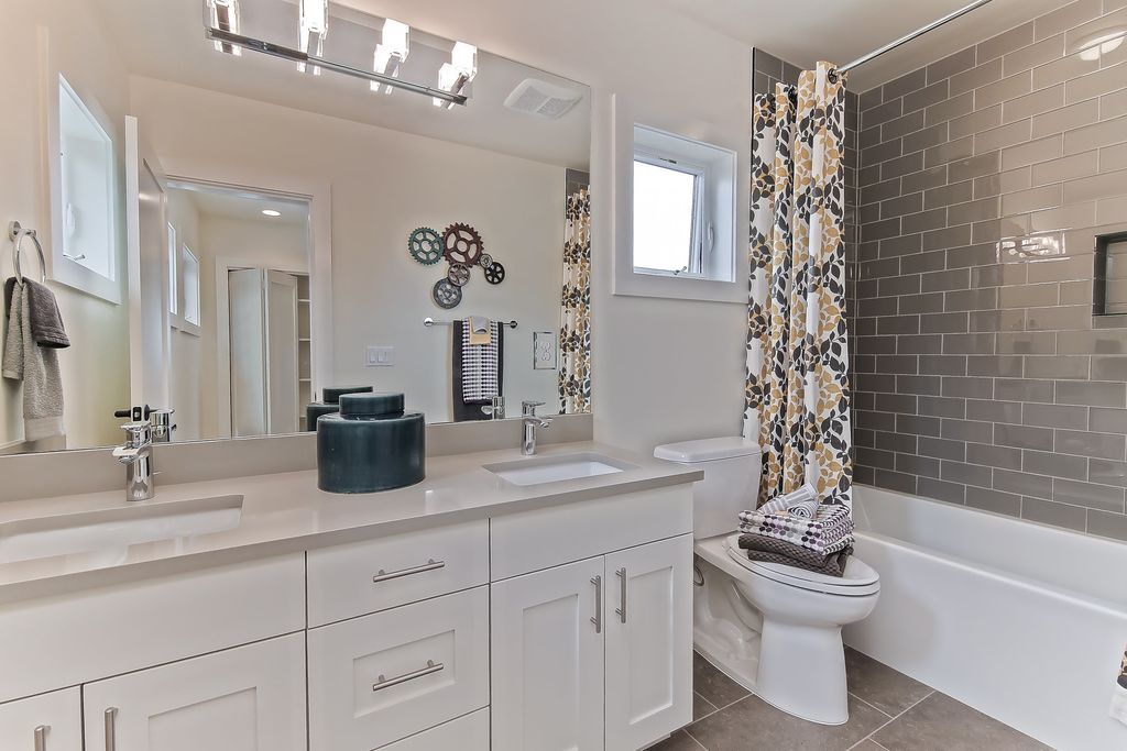 Bathroom renovation with budget-friendly cabinets and fixtures.