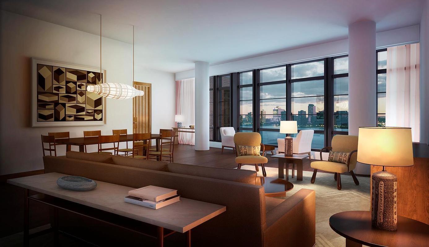 The apartment features floor-to-ceiling windows with a wide view of the Hudson River.