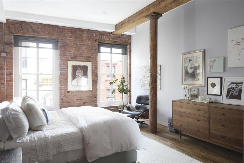 This South Street Seaport loft features many interior walls of exposed brick. 