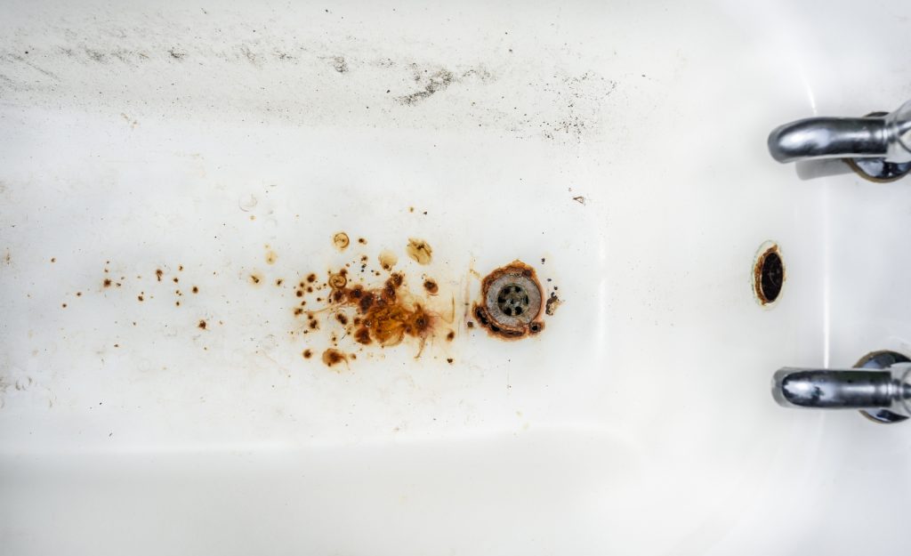 Photo of a bathtub with stains