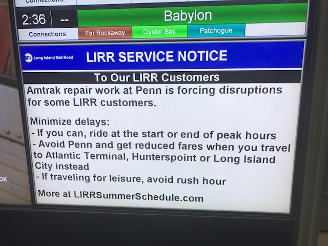 Photo of screen at Penn Station notifying customer of Amtrak work