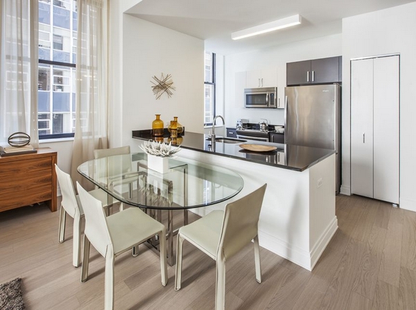 The kitchen in a three-bedroom unit at 70 Pine, available now for $7,886/month.