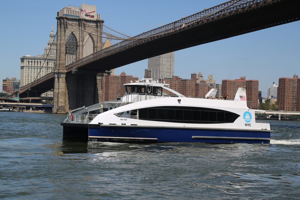 image of NYC ferry near Brooklyn Bridge