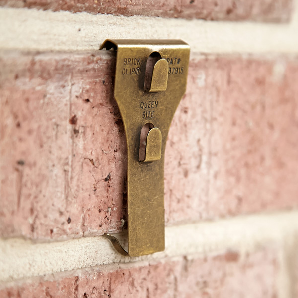 This nifty invention saves a lot of time and agony getting your brick walls decorated. Photo courtesy of The Container Store. 
