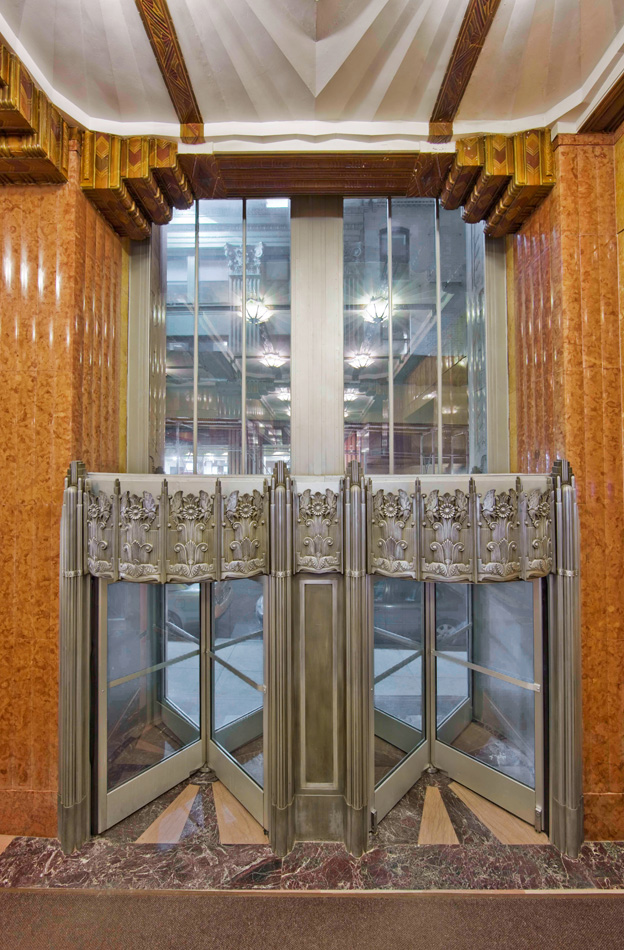 Revolving doors at the northwest entrance of 70 Pine.