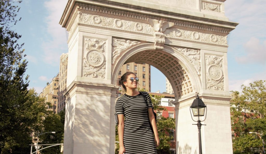 image of young woman in front of Washington Square Arch