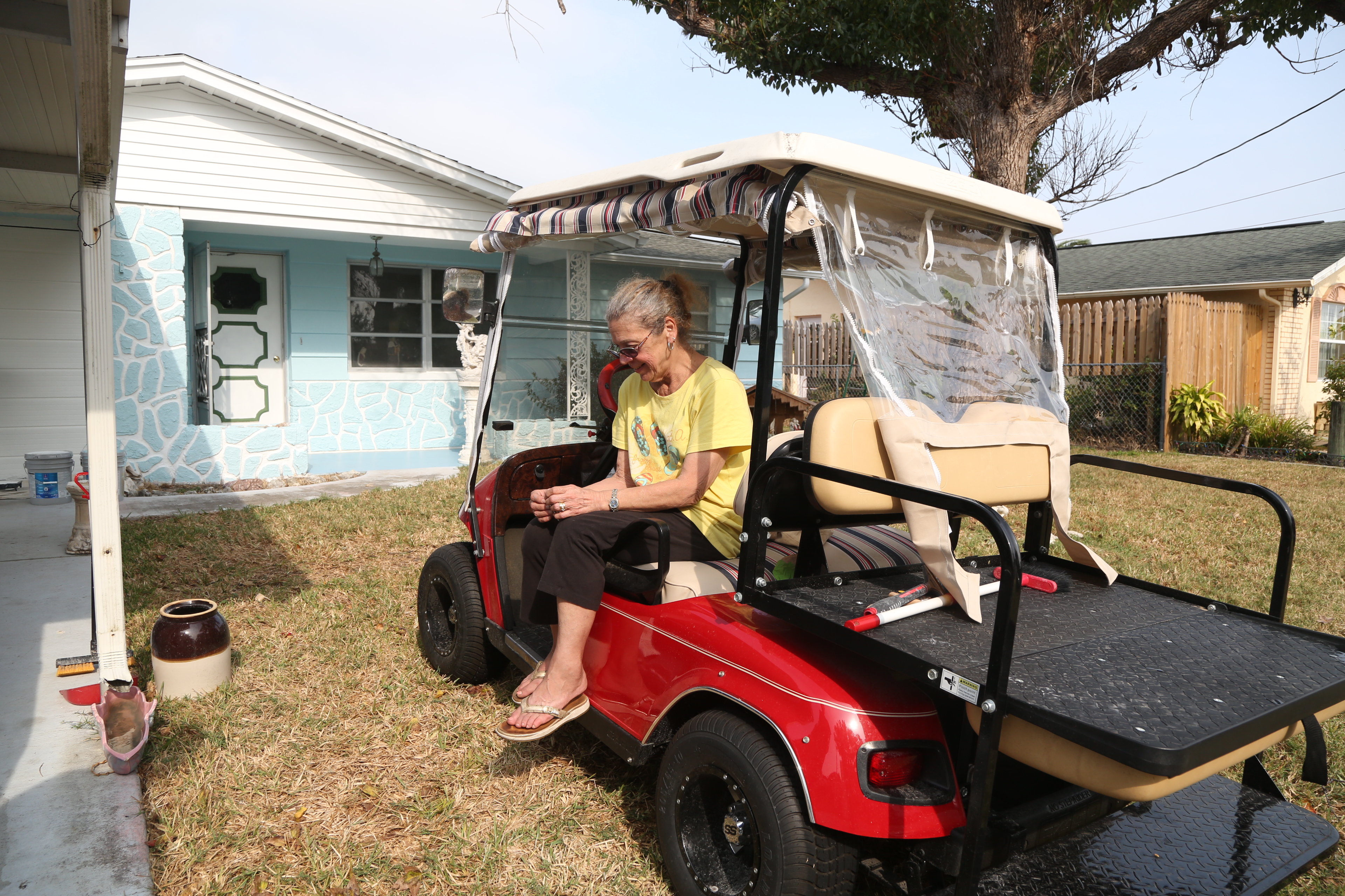 A woman who bought her evicted neighbor her house back.