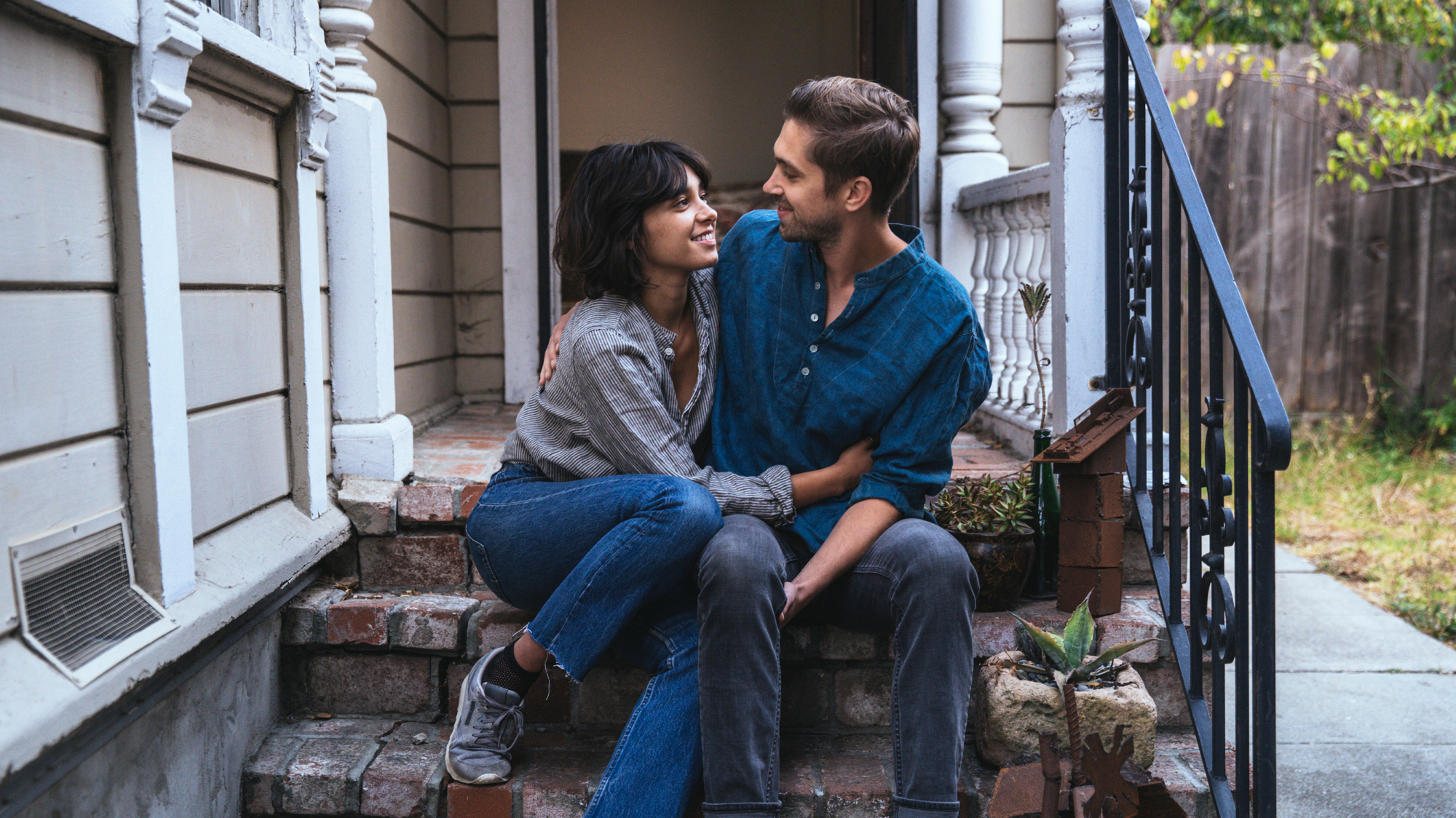 Couple on a porch in one of the hottest neighborhoods of 2019